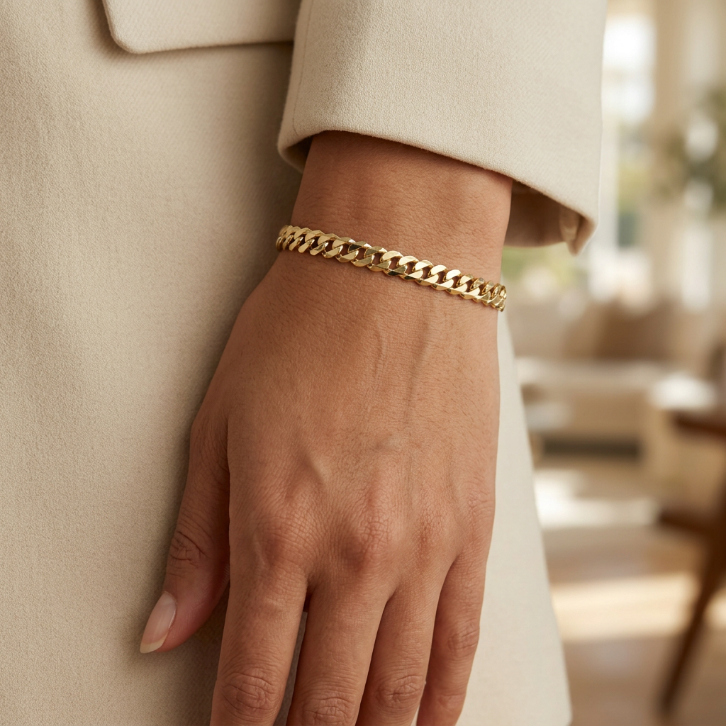 5mm yellow gold Cuban link bracelet worn on a wrist