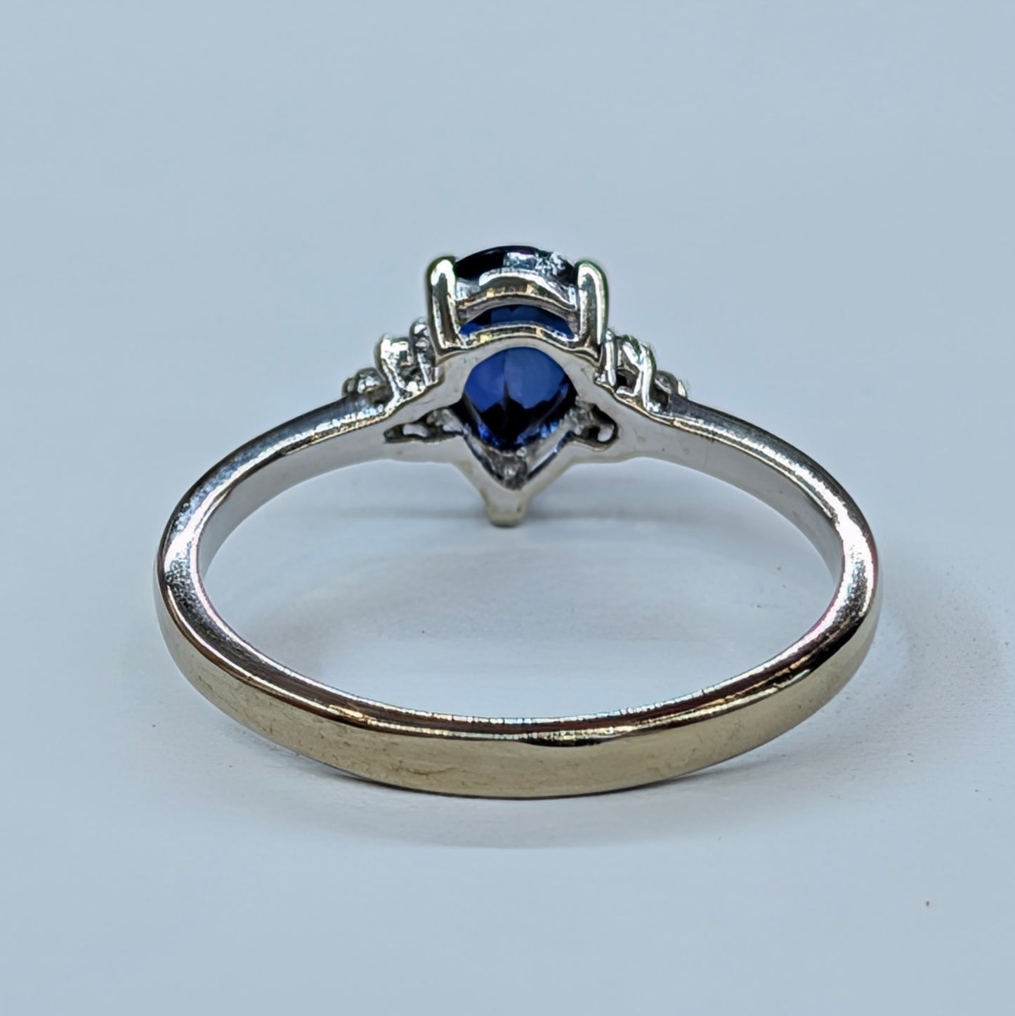 1/2CT Pear-Shaped Sapphire Ring with Diamond Accents – 10K White Gold (Size 7)  Timeless Sophistication in Deep Sapphire Blue