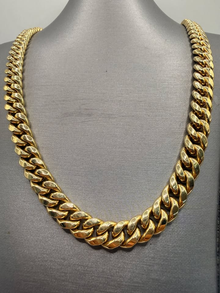 14K Yellow Gold Cuban Link Chain 22 Inch 9.5mm on bust, angled view showing full length