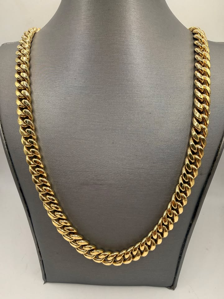 14K Yellow Gold Cuban Link Chain 22 Inch 9.5mm displayed on jewelry bust, front view