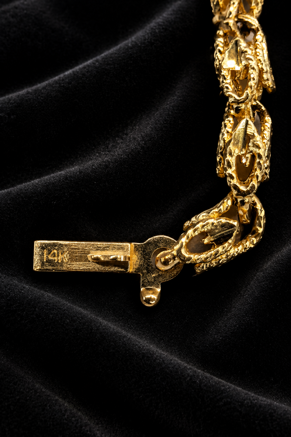 Clasp detail on charcoal velvet