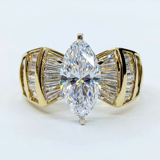 Front view of the marquise and baguette ring on a white background