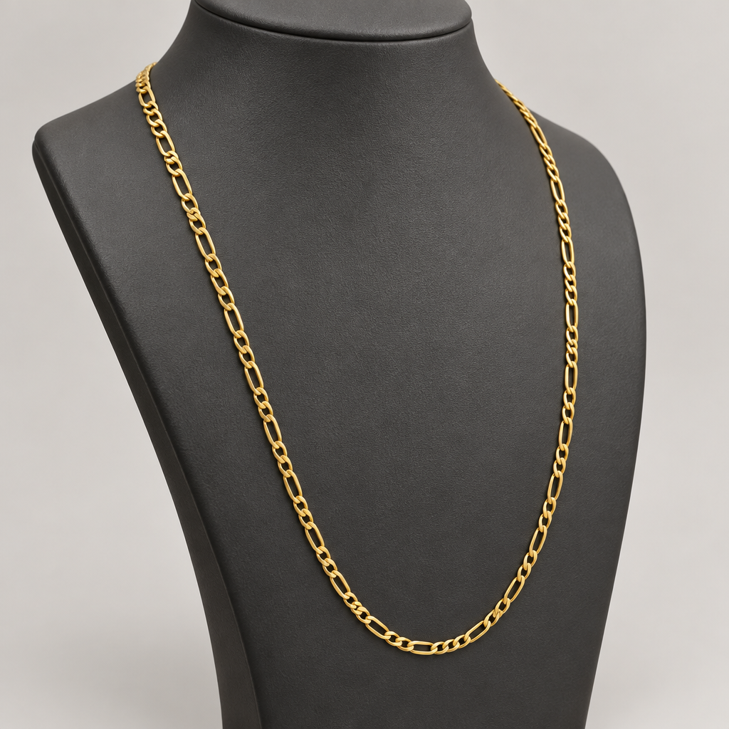 20 inch yellow gold Figaro necklace on charcoal display bust