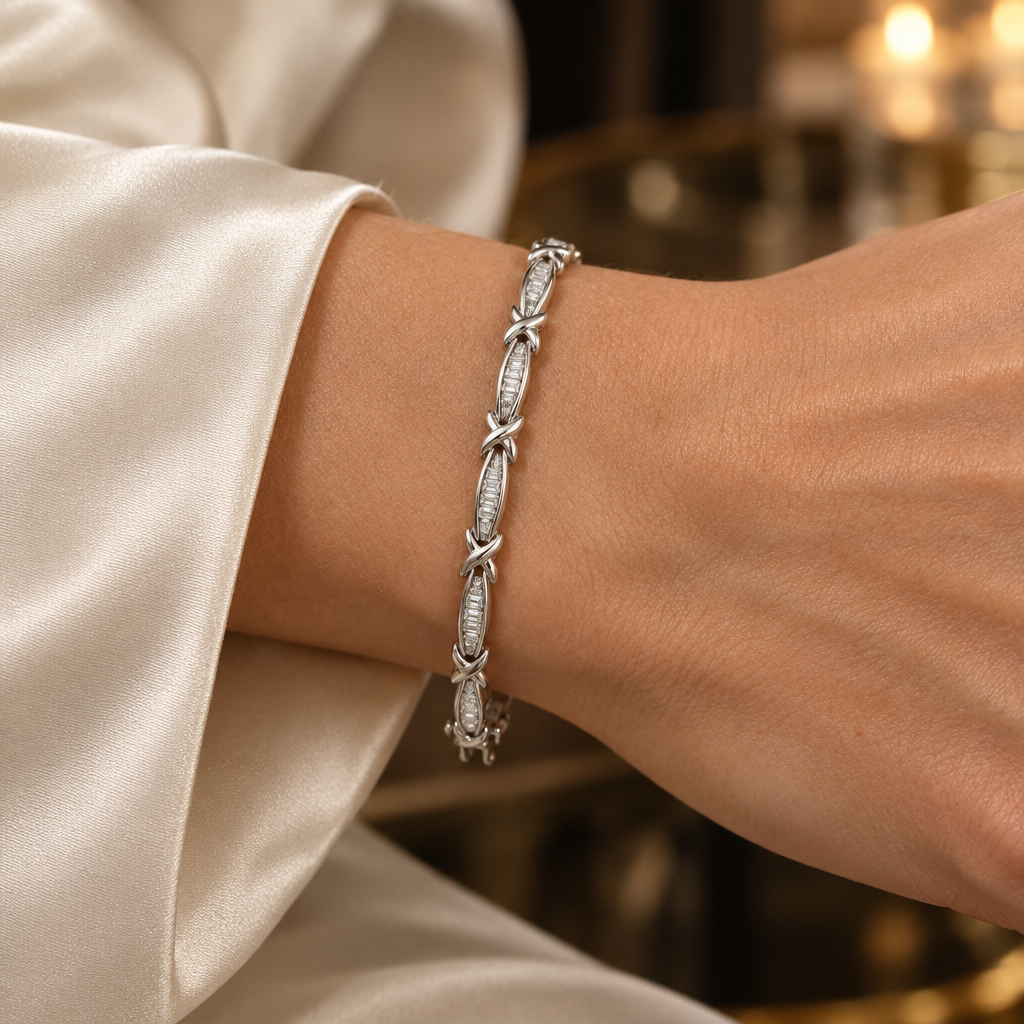 White gold baguette diamond bracelet worn at realistic scale on a woman’s wrist