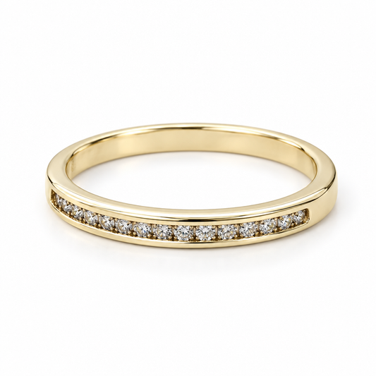 10K yellow gold diamond band with a single channel-set diamond row on a white background