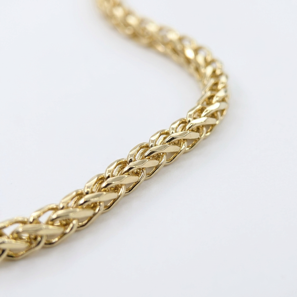 Close-up of interwoven Franco links in yellow gold