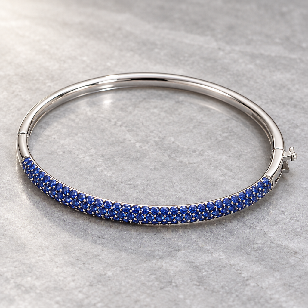 Rear and side view of a hinged 14K white gold sapphire bangle and clasp