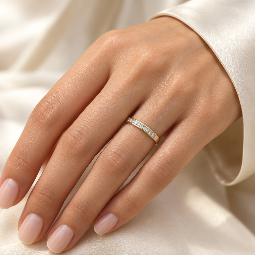 Size 7 yellow gold natural diamond band worn on a hand