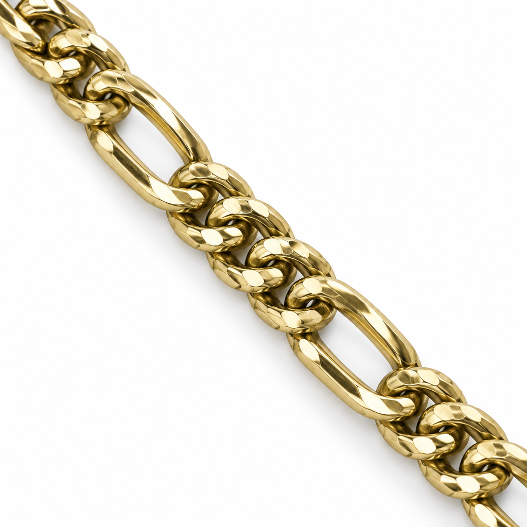 Close-up of yellow gold Figaro bracelet links