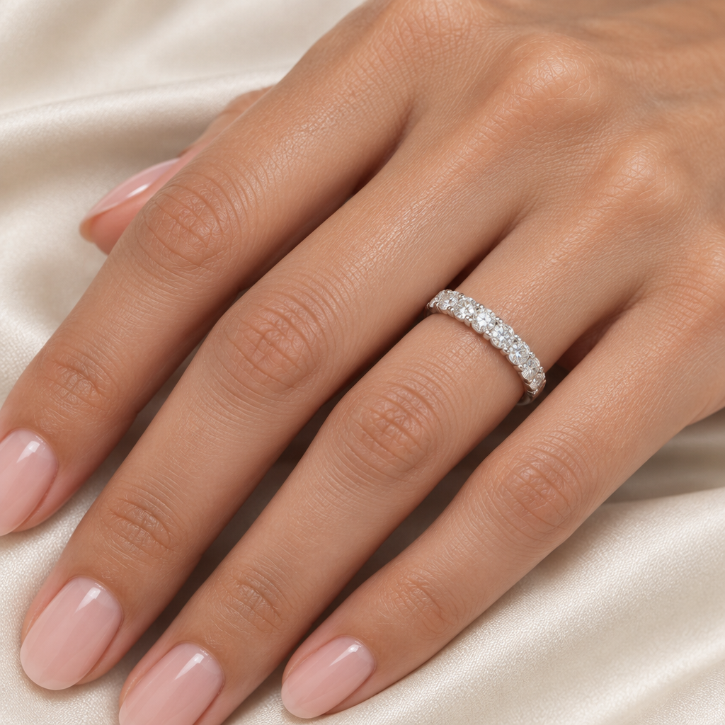 Size 6 white gold diamond band worn on a hand