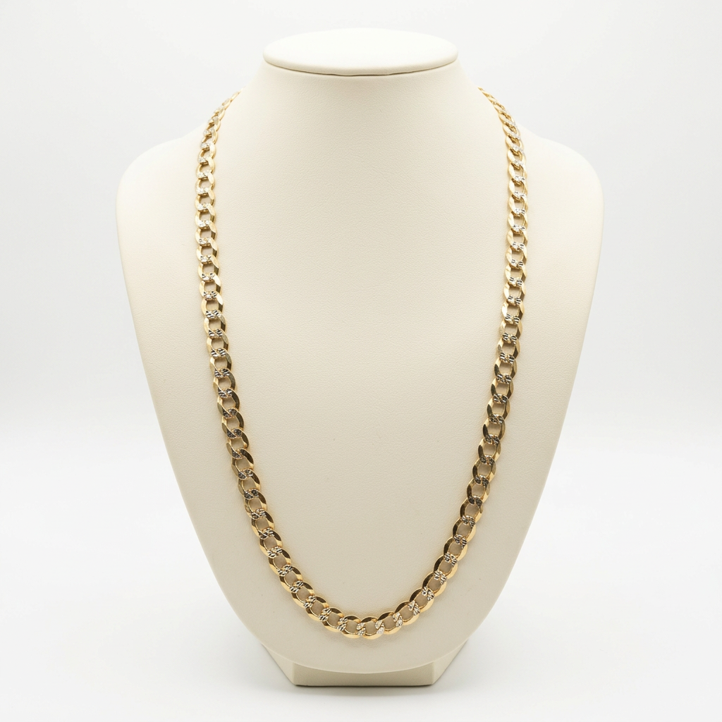 14K yellow gold diamond-cut curb link chain displayed on an ivory bust