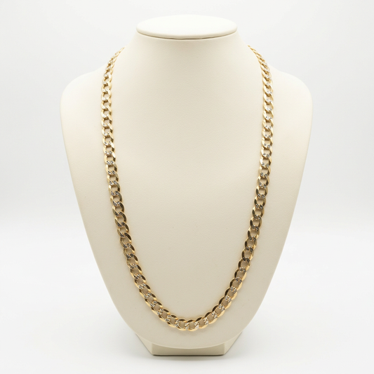 14K yellow gold diamond-cut curb link chain displayed on an ivory bust