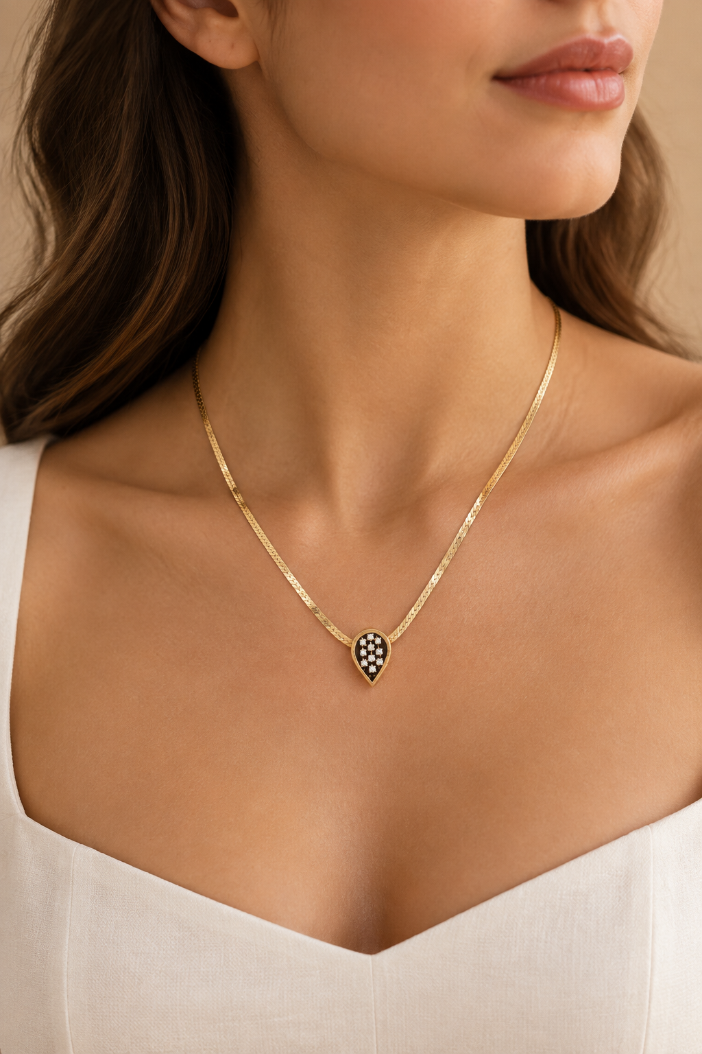 Woman wearing the 14K gold herringbone diamond necklace