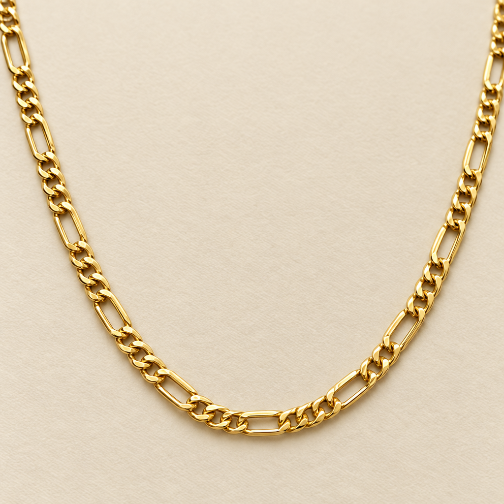Close-up of polished yellow gold Figaro links