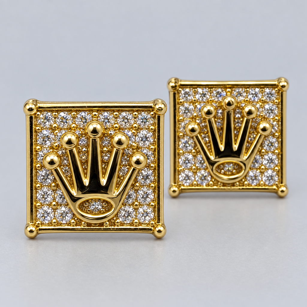 Close-up of polished five-point gold crown and diamond details on square stud earrings