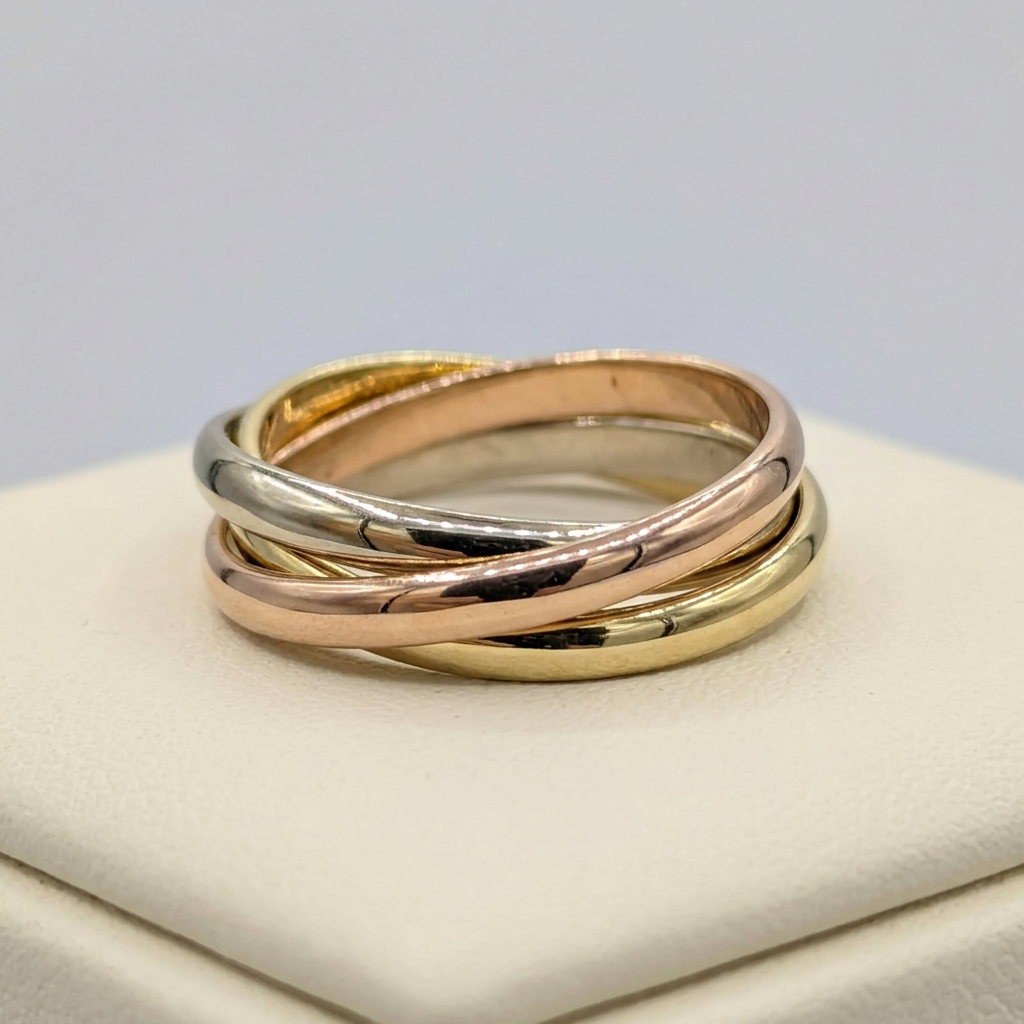 Side view of G099 yellow, white, and rose gold interlocking bands