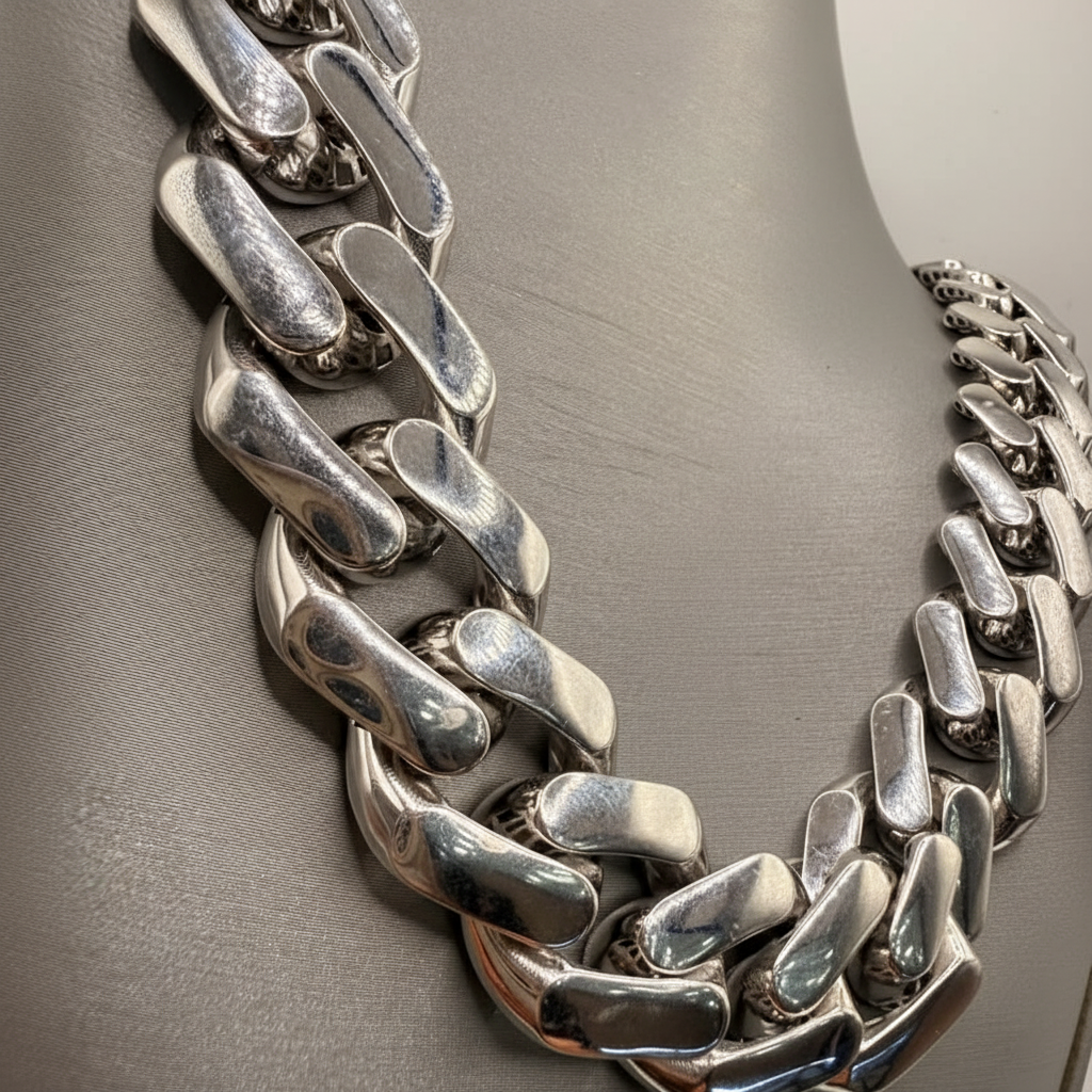 Close-up of polished interlocking links on an 18K white gold Miami Cuban chain