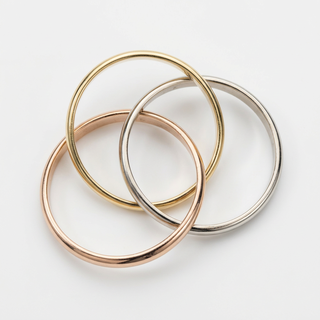 Open arrangement showing three interlocking 14K tri-color gold bands