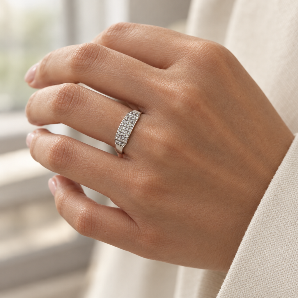10K white gold diamond ring worn on a hand with a cream sleeve