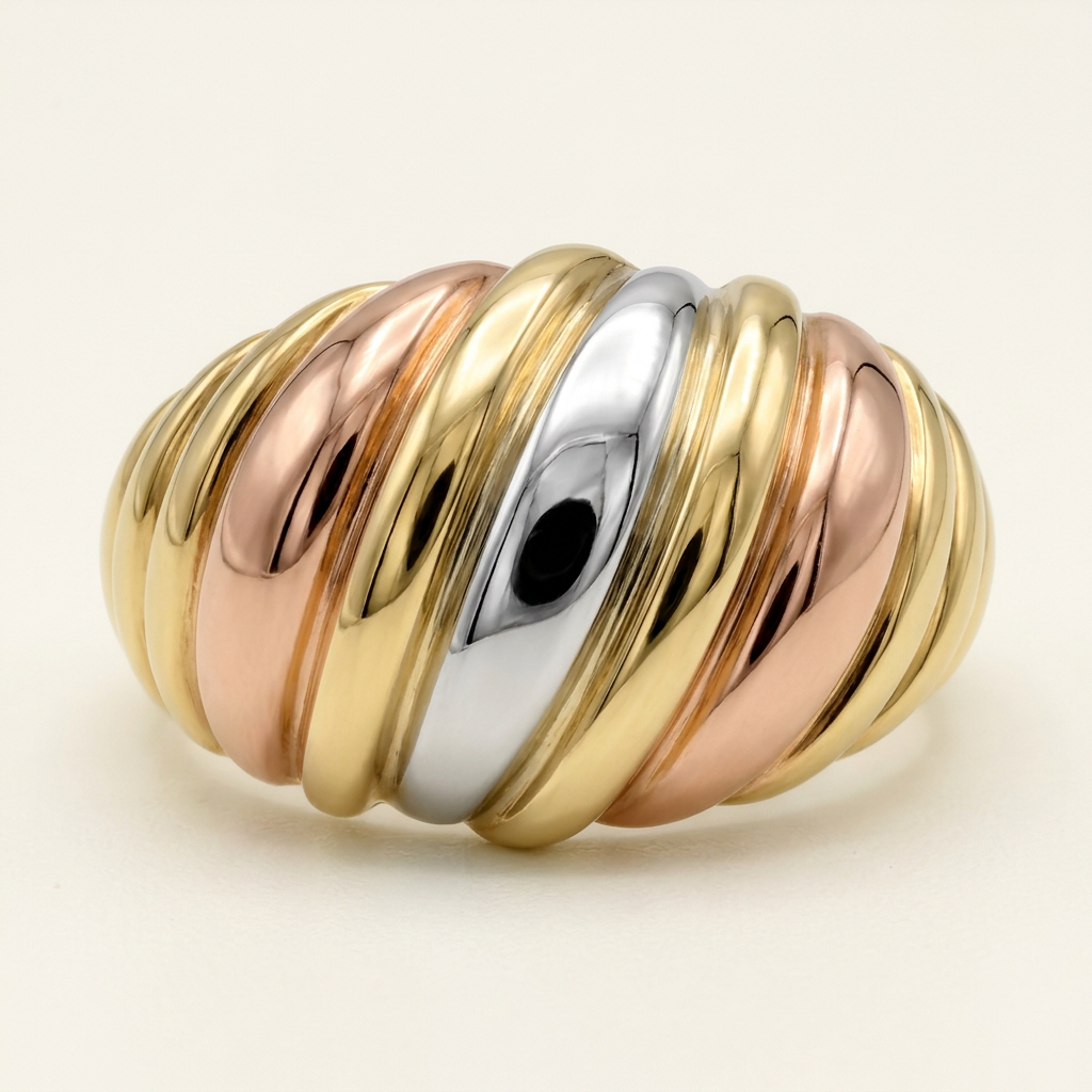 Front detail of the diagonal flutes on a 10K tricolor gold ring