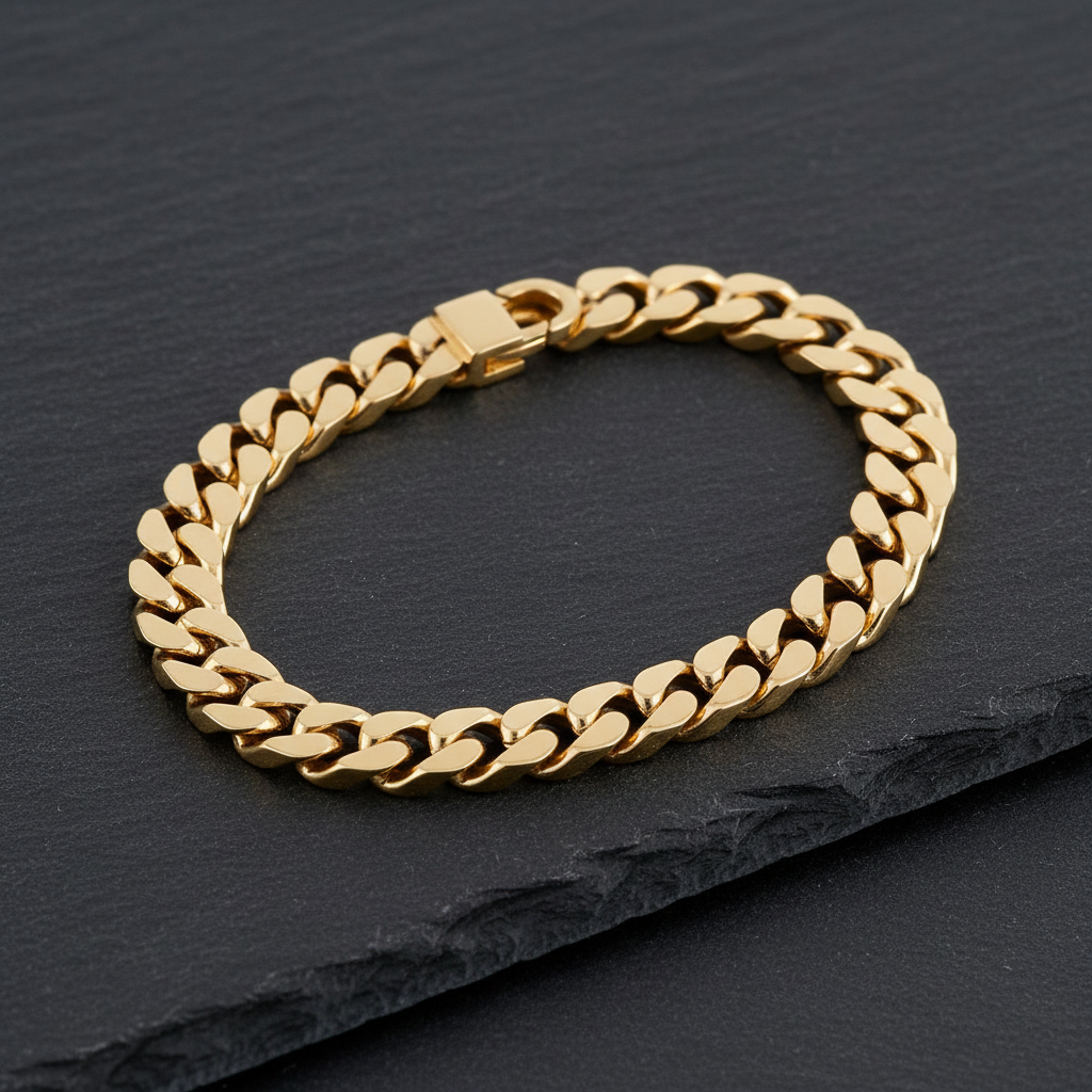 10K Yellow Gold Cuban Link Bracelet overhead view on dark slate