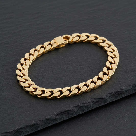 10K Yellow Gold Cuban Link Bracelet overhead view on dark slate