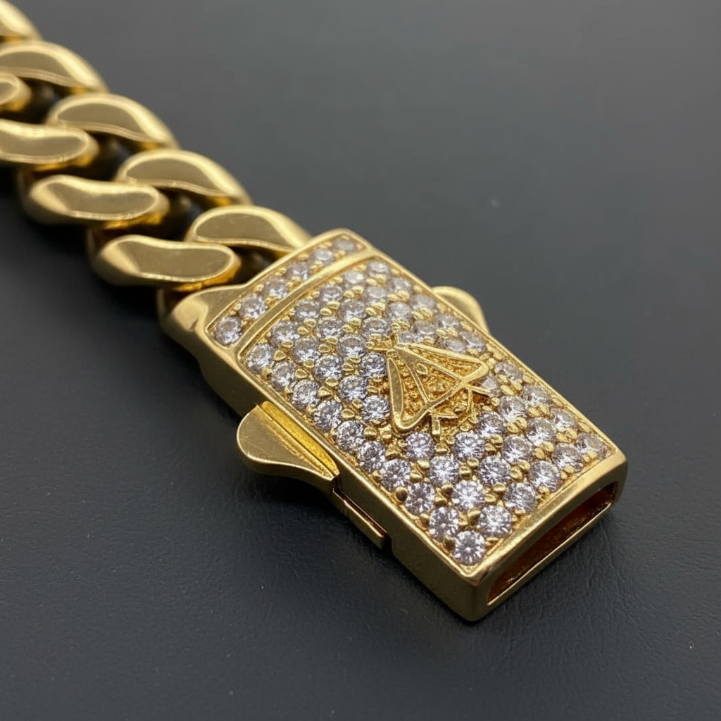 Close-up of the CZ-encrusted clasp on a 10K yellow gold Cuban link bracelet
