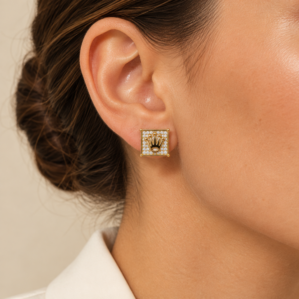 Model wearing a yellow gold diamond crown square stud earring