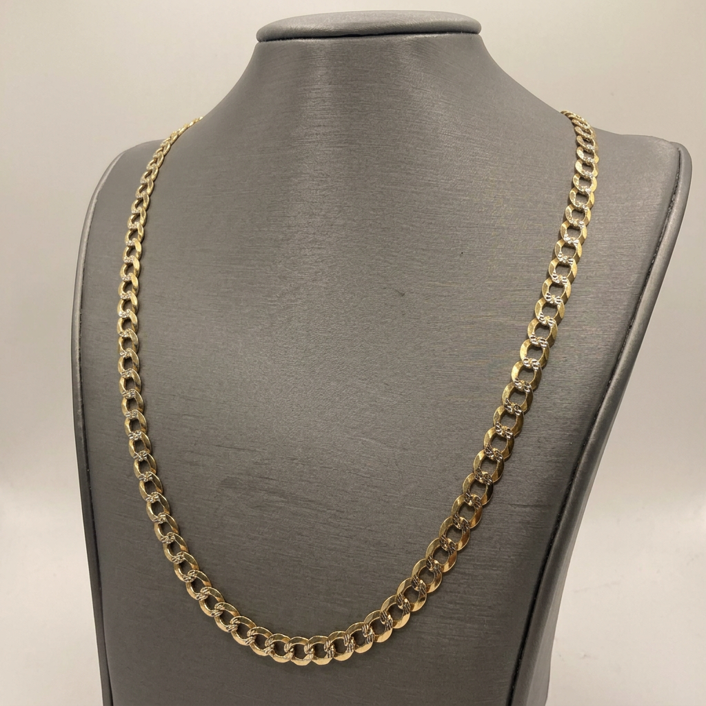 Angled view of 22-inch yellow gold curb chain on a charcoal bust
