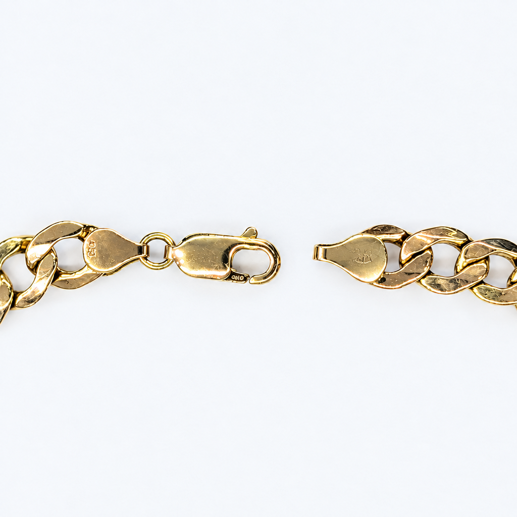 Lobster clasp close-up with engraved hallmark detail