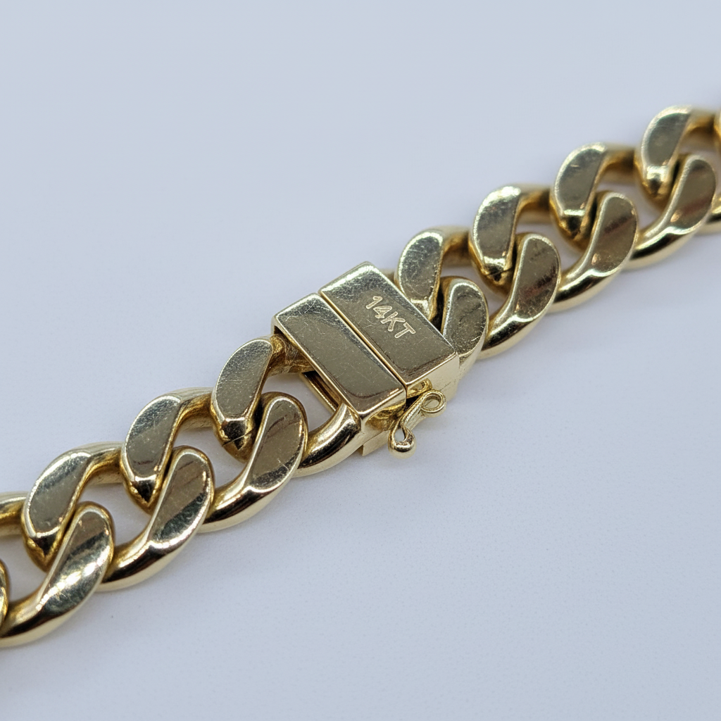 14K Yellow Gold Cuban Link Bracelet clasp close-up with 14KT hallmark