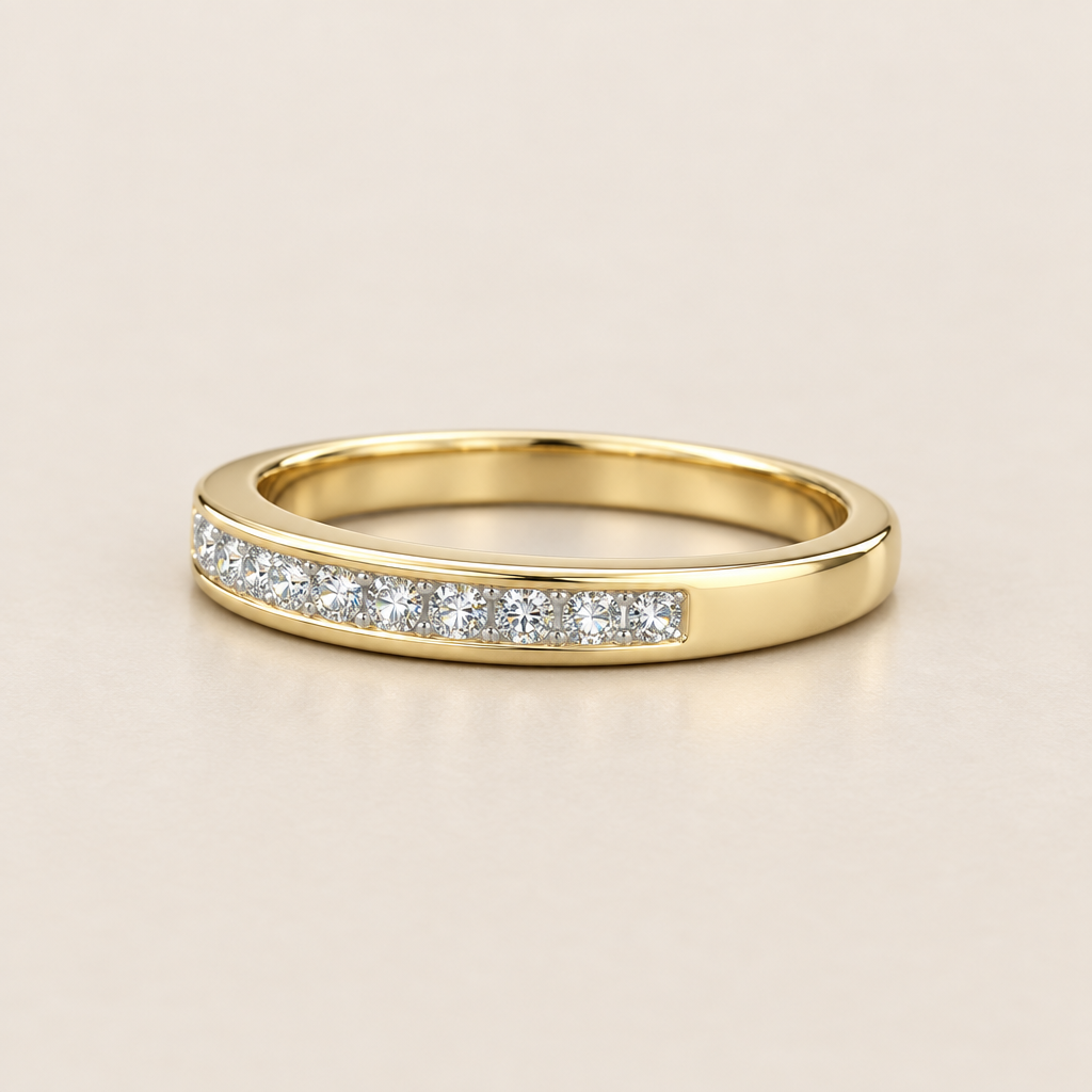 Side view of yellow gold diamond band showing plain gold shank