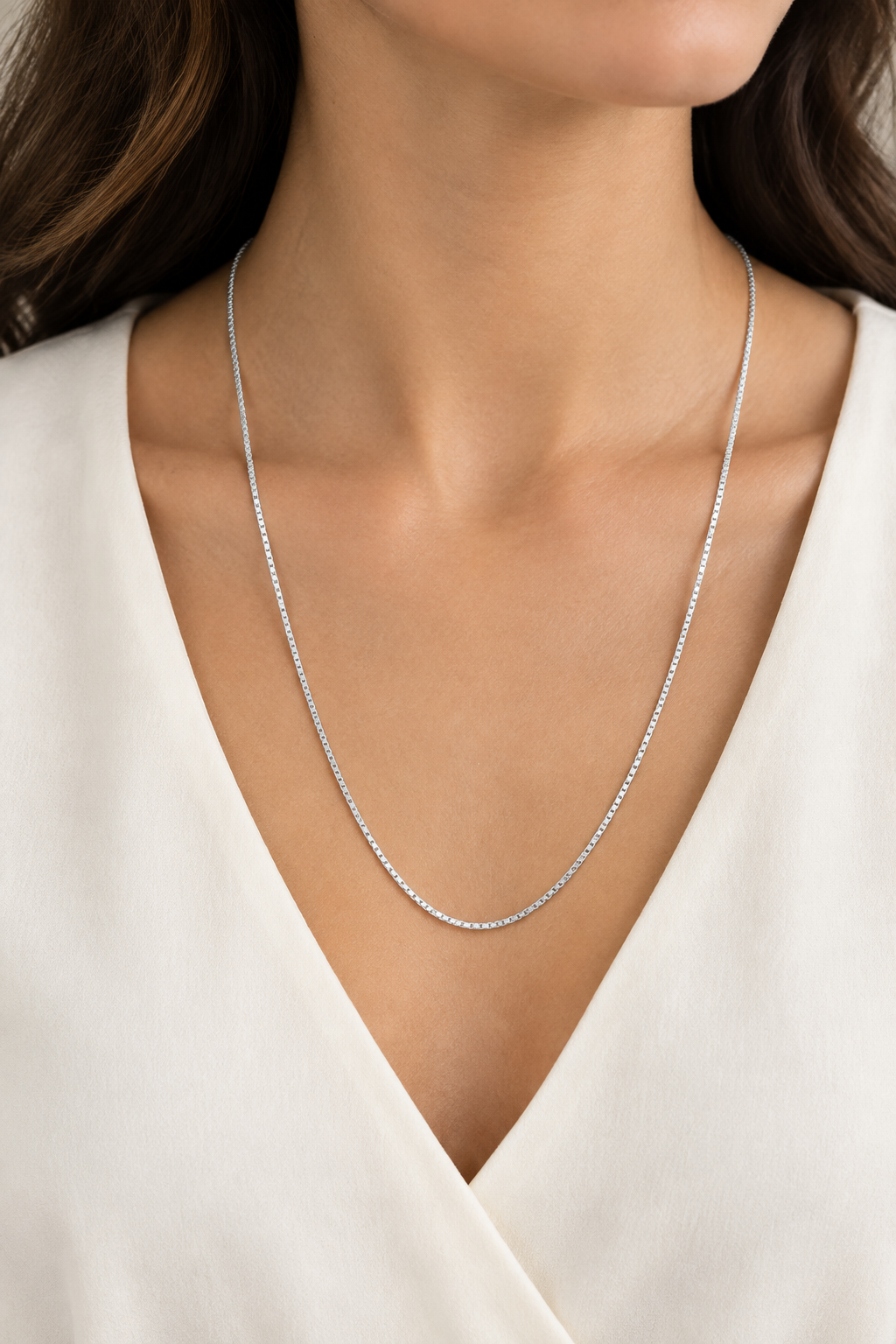 Model wearing a 24-inch white gold box link necklace