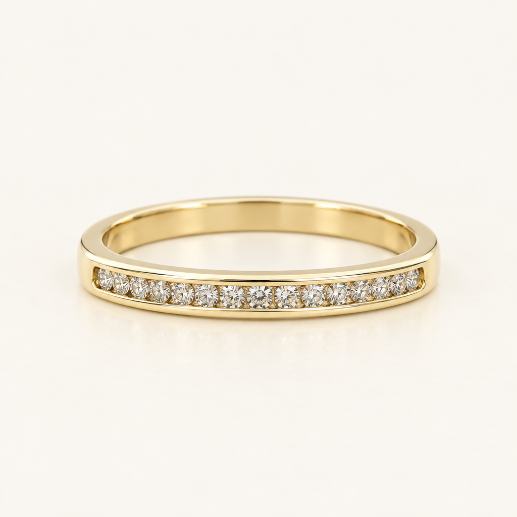 Front detail of the round diamonds and smooth gold borders of the size 10 diamond band