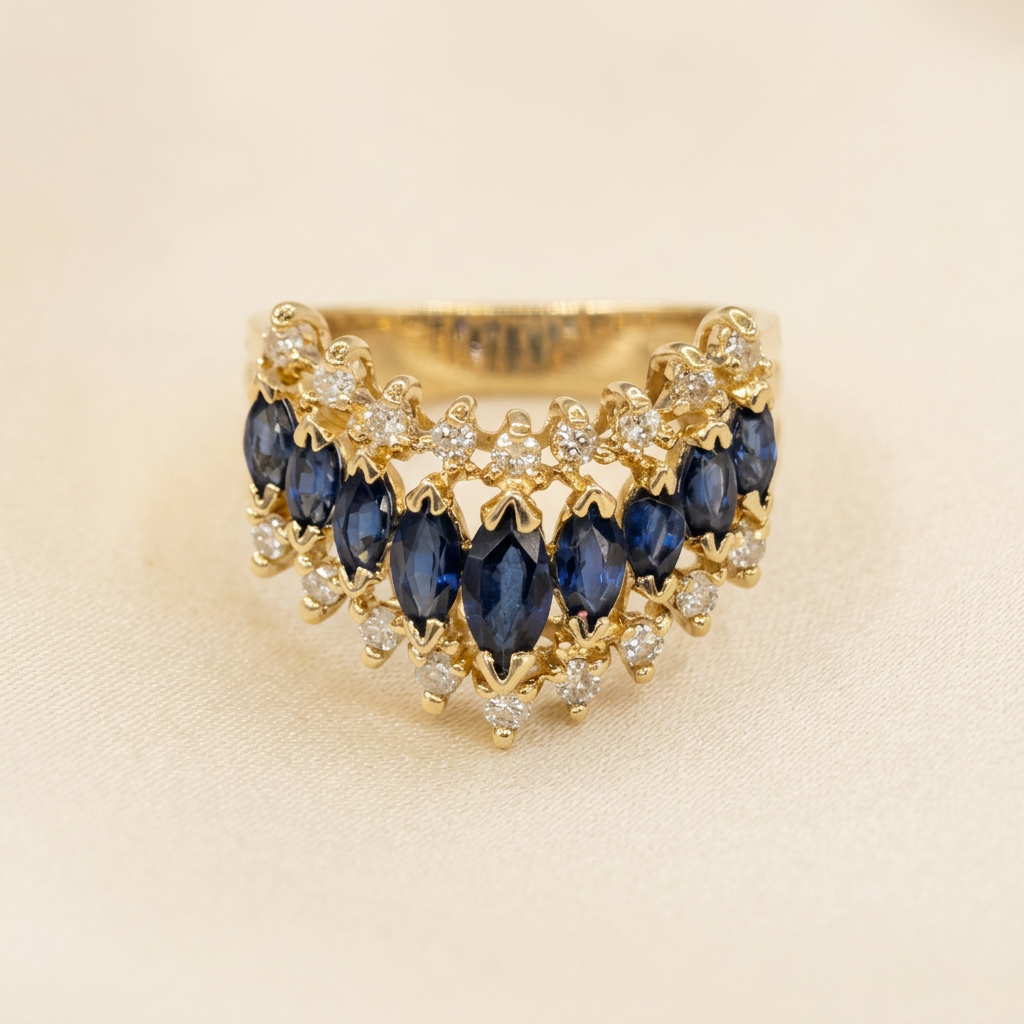 G389 graduated marquise sapphire row with scalloped diamond borders