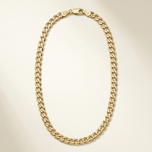 14K yellow gold 5.8mm curb chain necklace arranged in an elongated oval