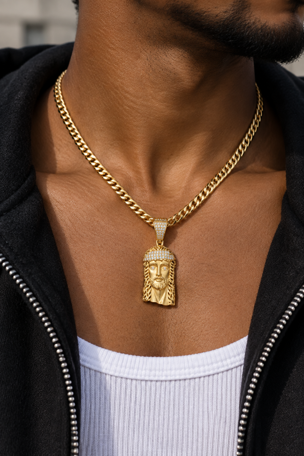 Man wearing 14K gold Jesus head charm pendant on chain, correctly proportioned