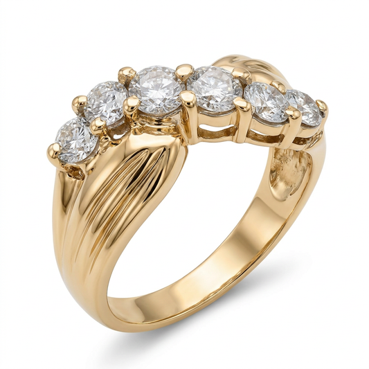 Three-quarter view of a 14K yellow gold natural diamond wave ring with sculpted shoulders