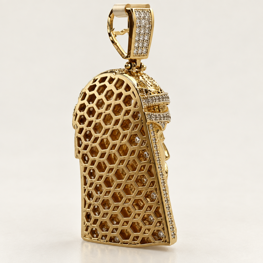 Open honeycomb back and bail of a 10K yellow gold CZ Jesus head charm