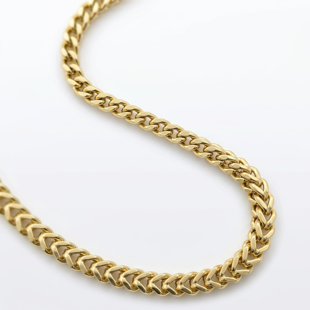 Close-up of polished yellow gold Franco chain links