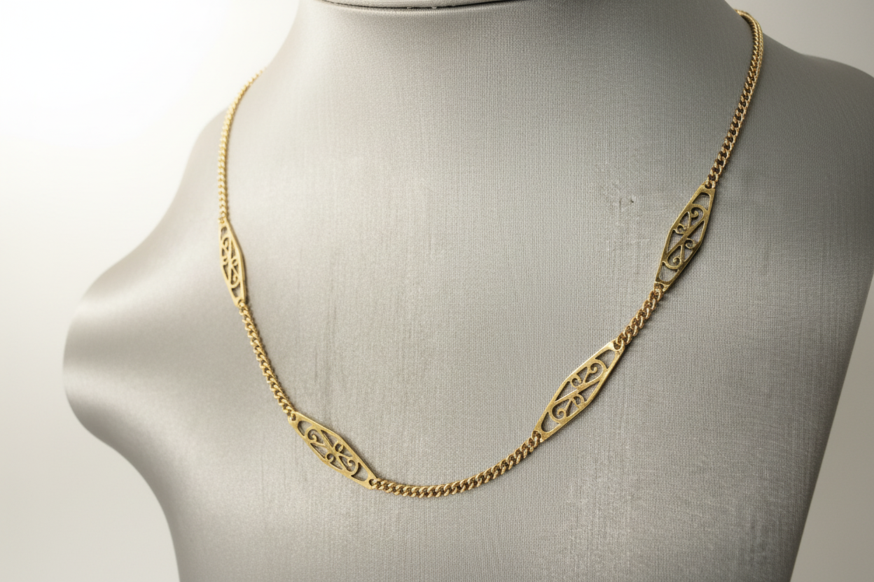 18K yellow gold filigree necklace draped on bust