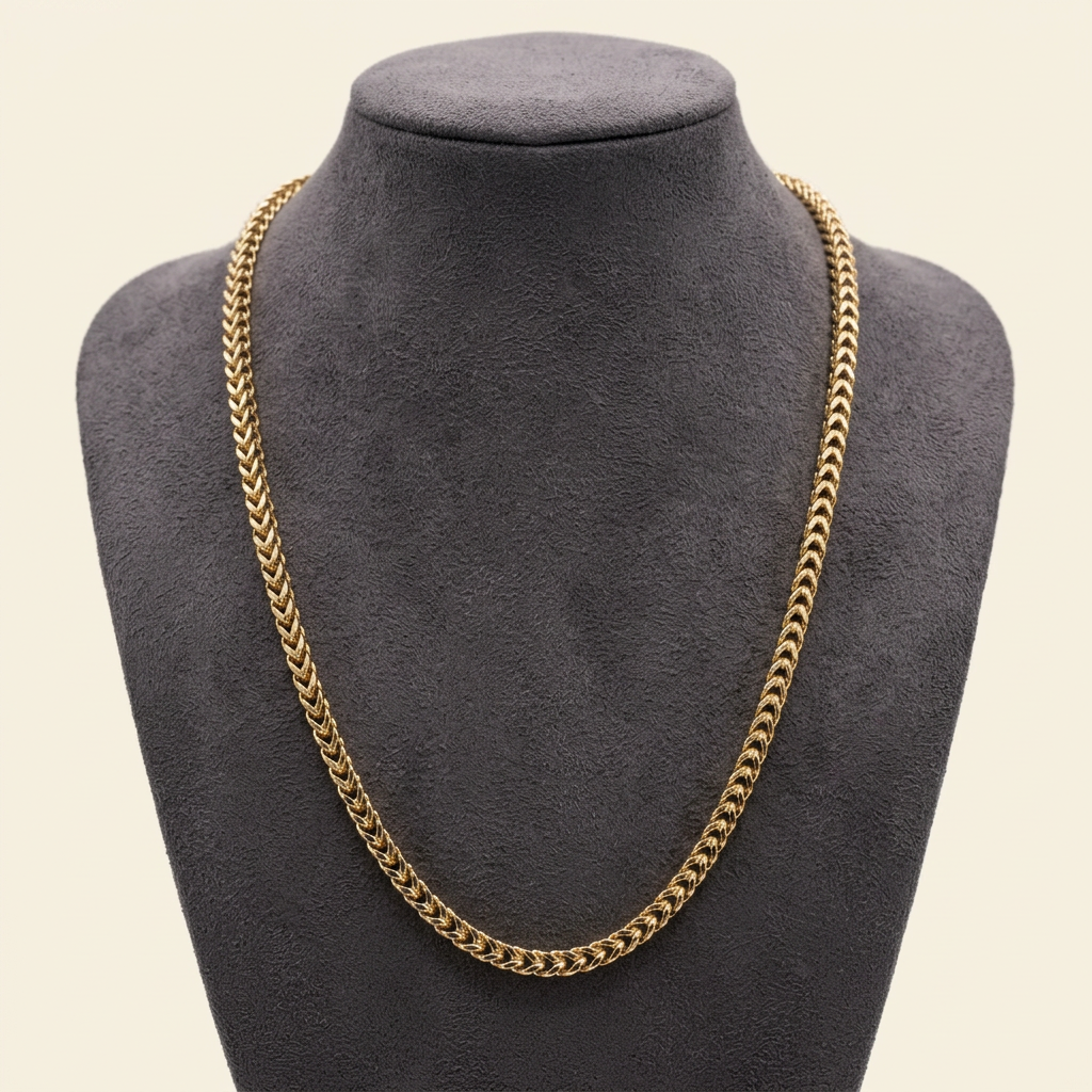 R1944 yellow gold Franco link chain on a charcoal bust