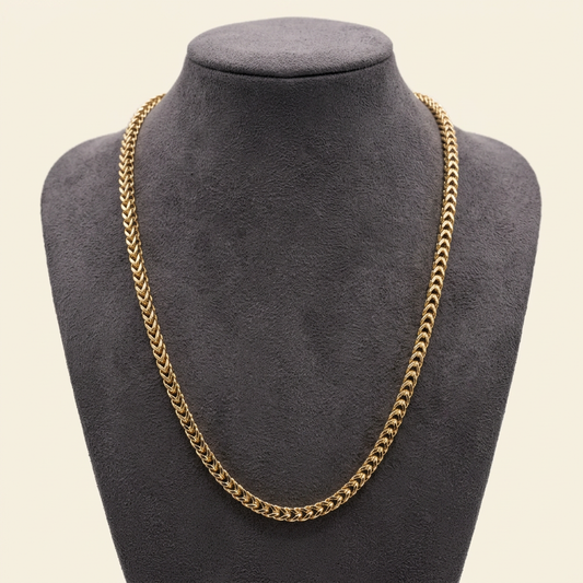 R1944 yellow gold Franco link chain on a charcoal bust
