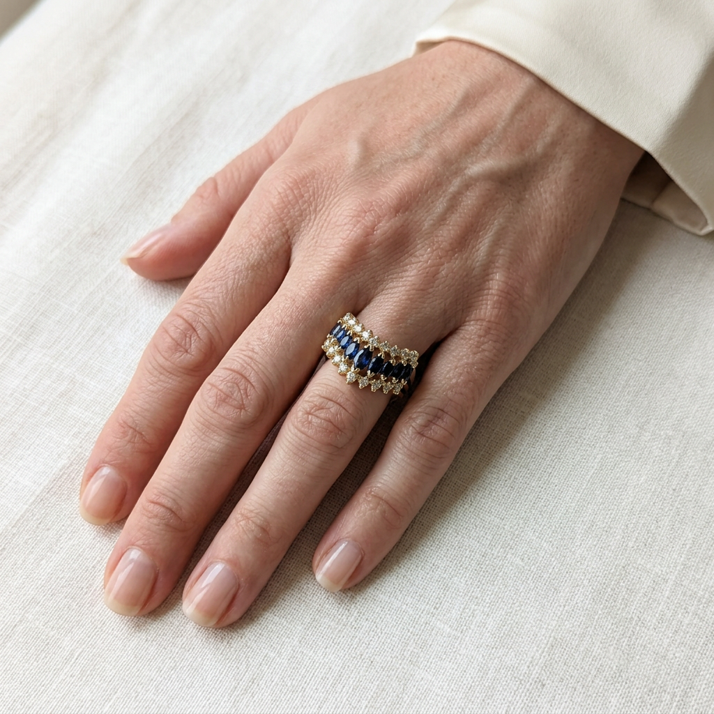 G389 yellow gold sapphire and diamond ring worn on the ring finger