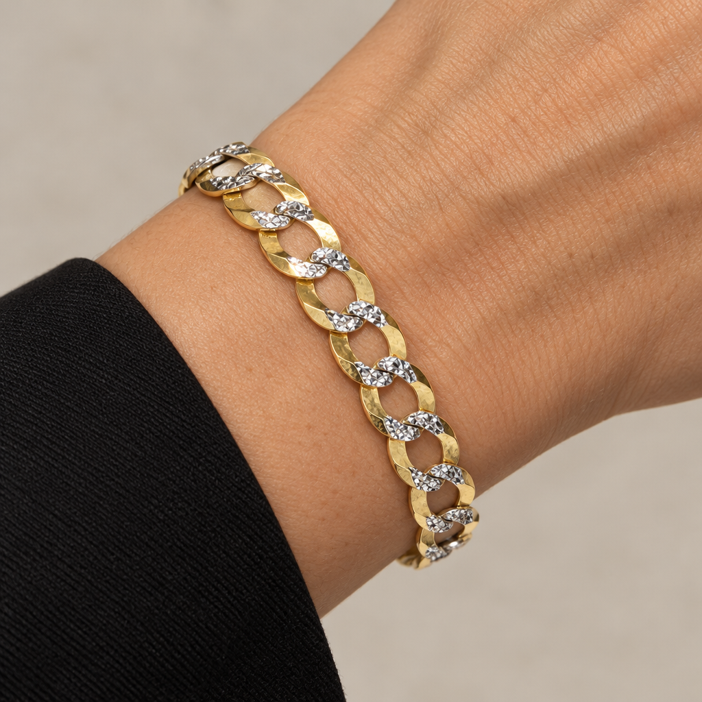 8.52mm yellow gold curb link bracelet worn on a wrist