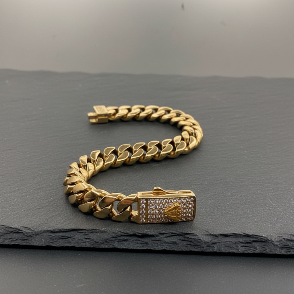 10K yellow gold Cuban link bracelet displayed on dark stone